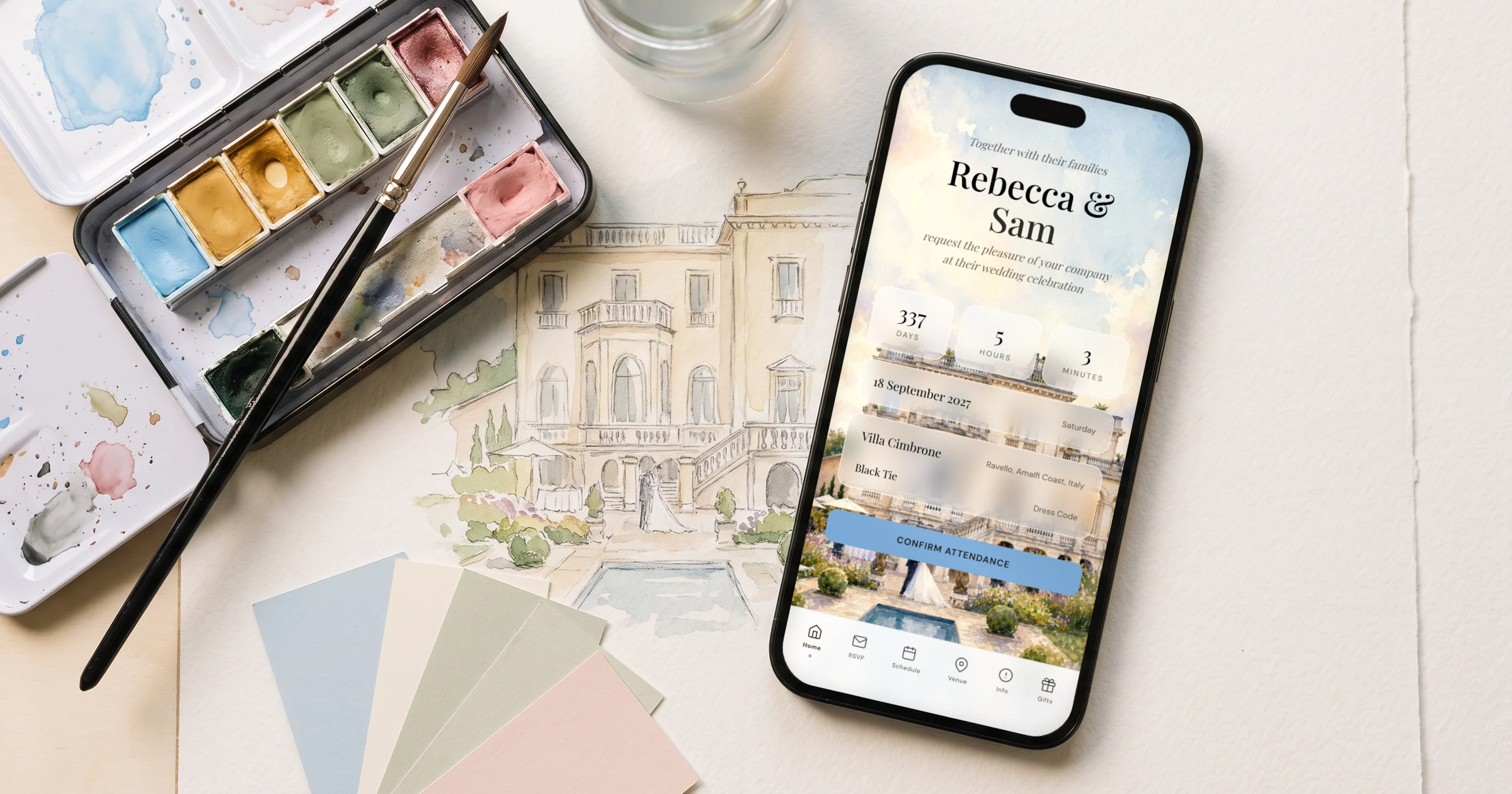 Custom wedding invitation design: a phone shows a custom digital invitation cover painted from the venue, beside a watercolor sketch and paint palette