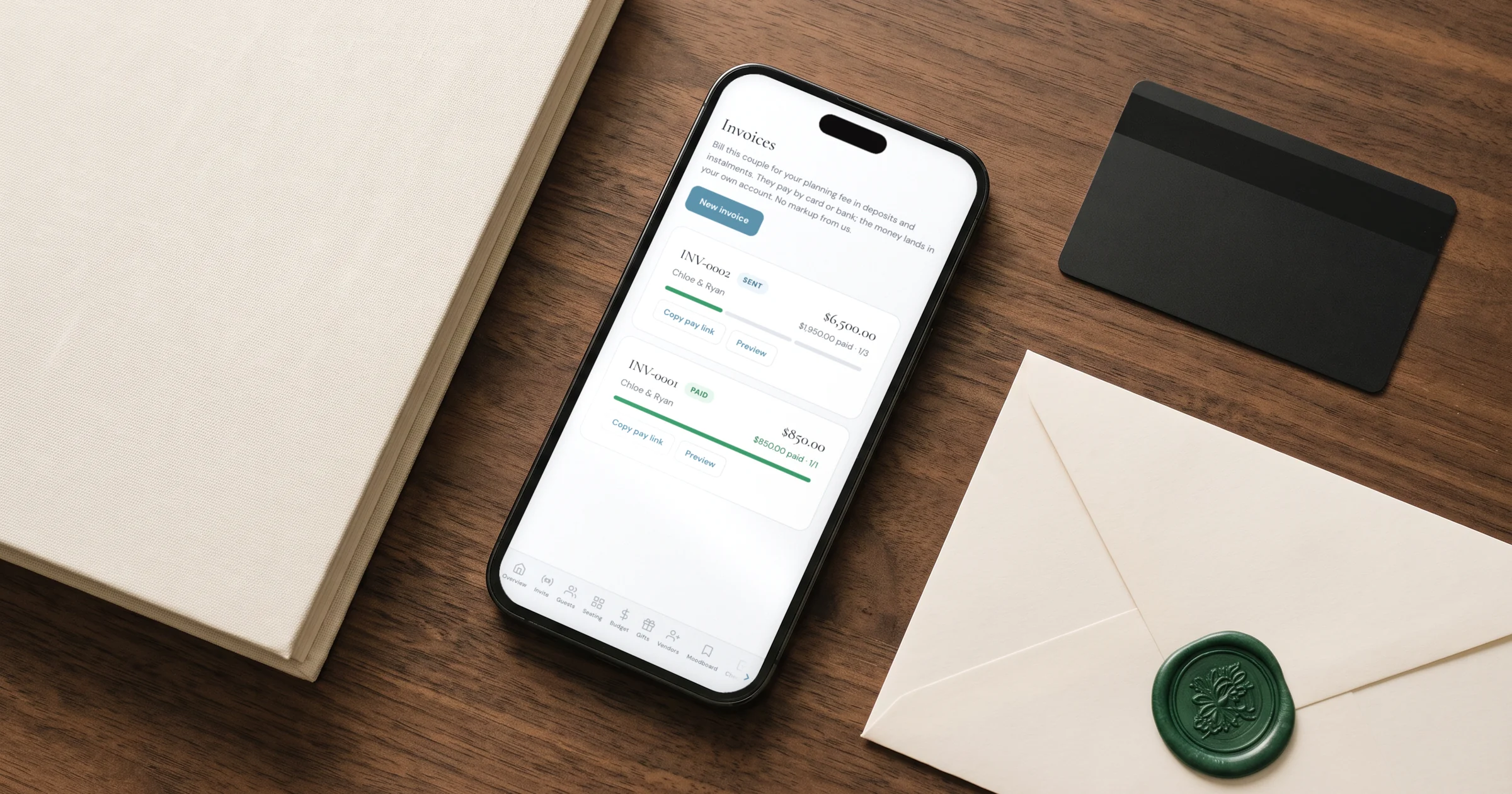 Deposits and payment plans for wedding clients: a phone shows a planning invoice paid in three instalments with the deposit received